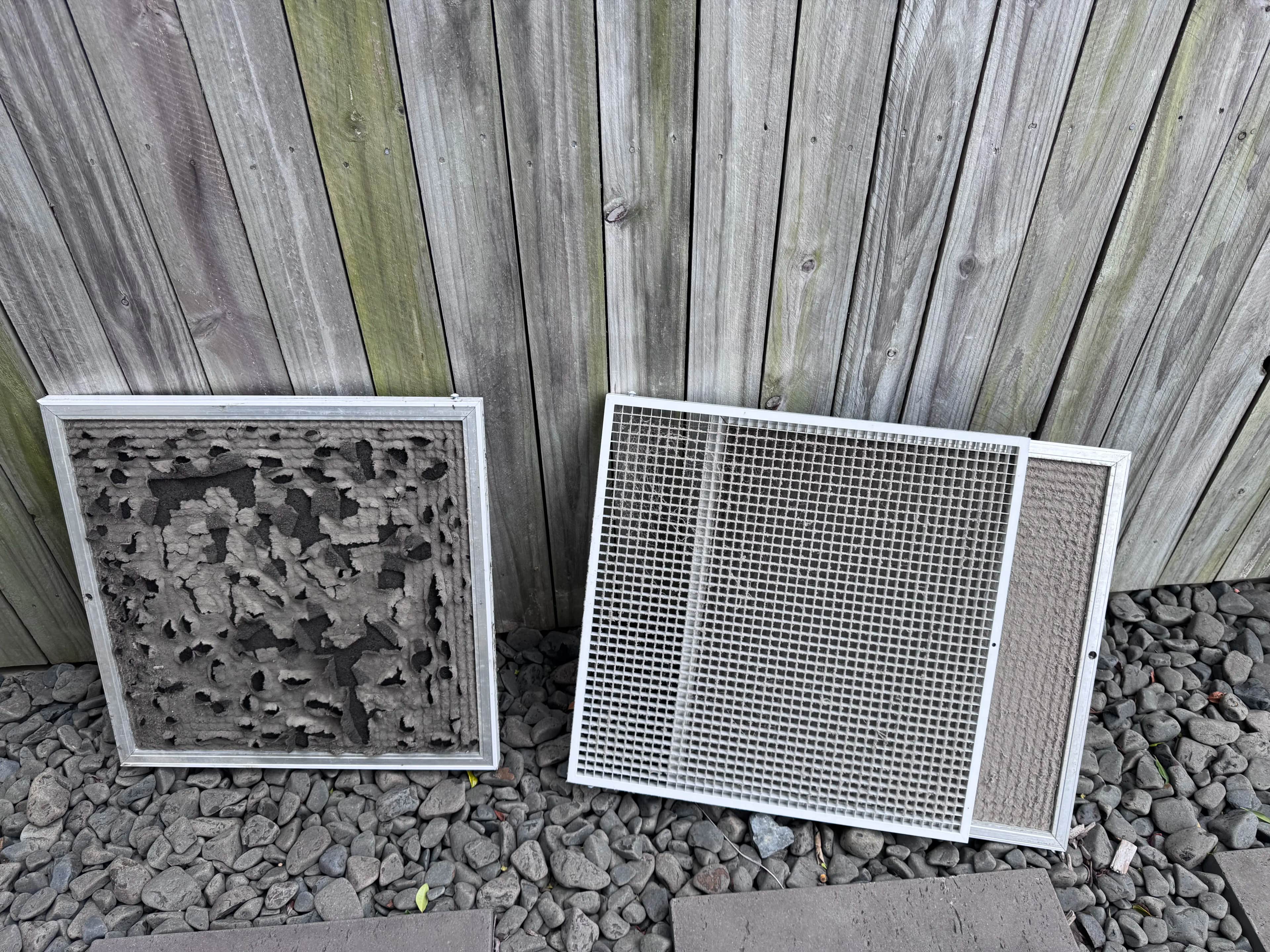 Installing new clean return air filter to replace worn out filter