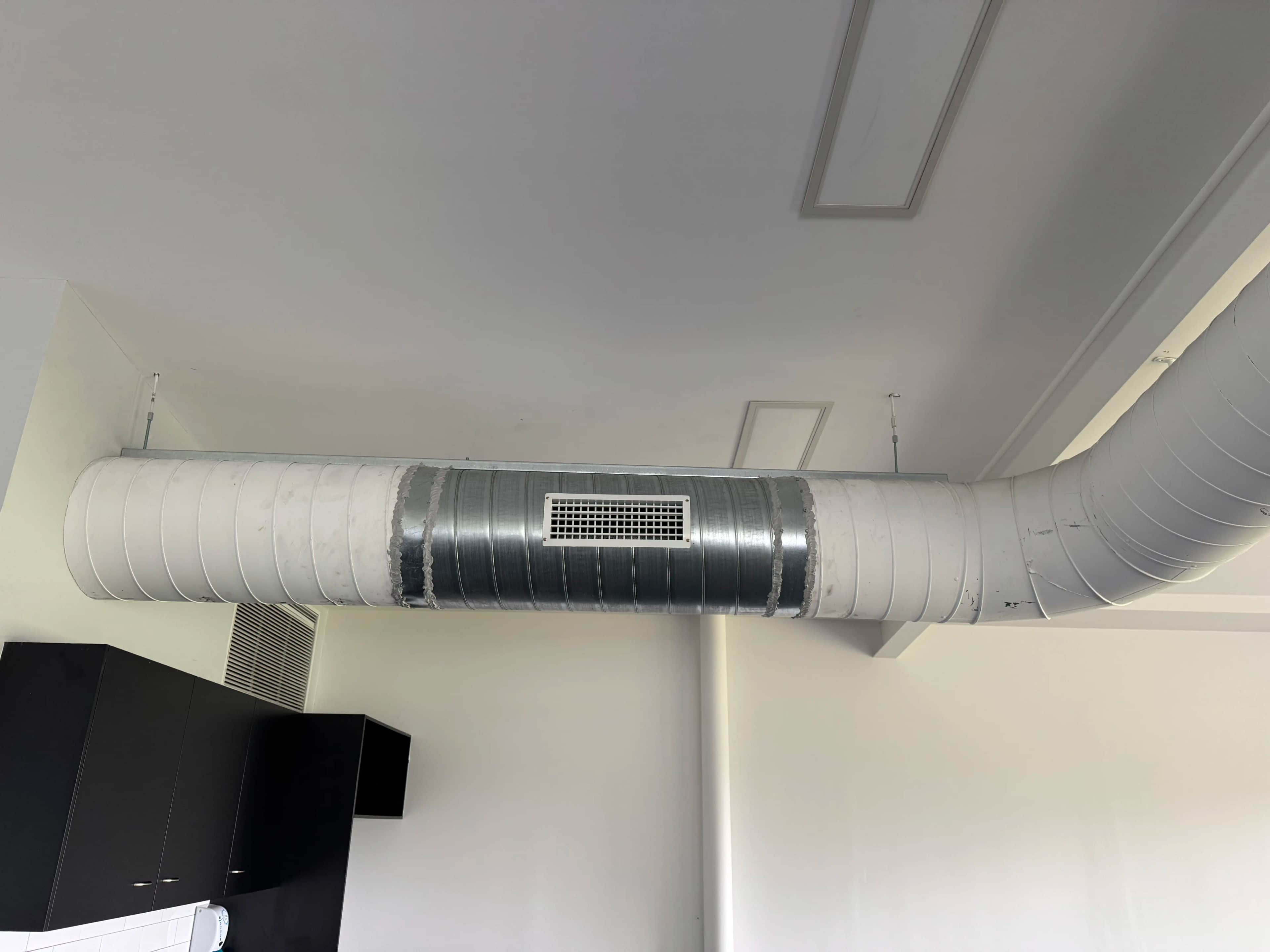 Ducted system mounted in high attic trusses